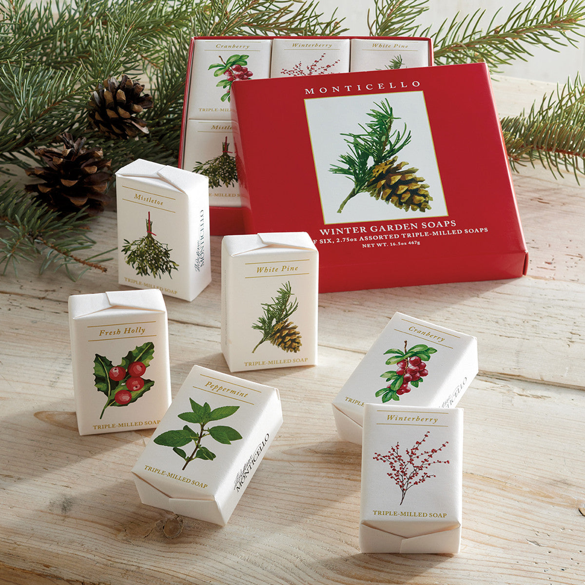 Bars of a variety of botanical winter soaps arranged on a table